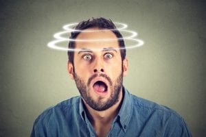 a photo of a surprised man with rings around his head
