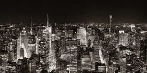 a black and white photo of the New York City skyline at night