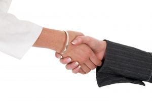 a closeup of two women shaking hands on a white background
