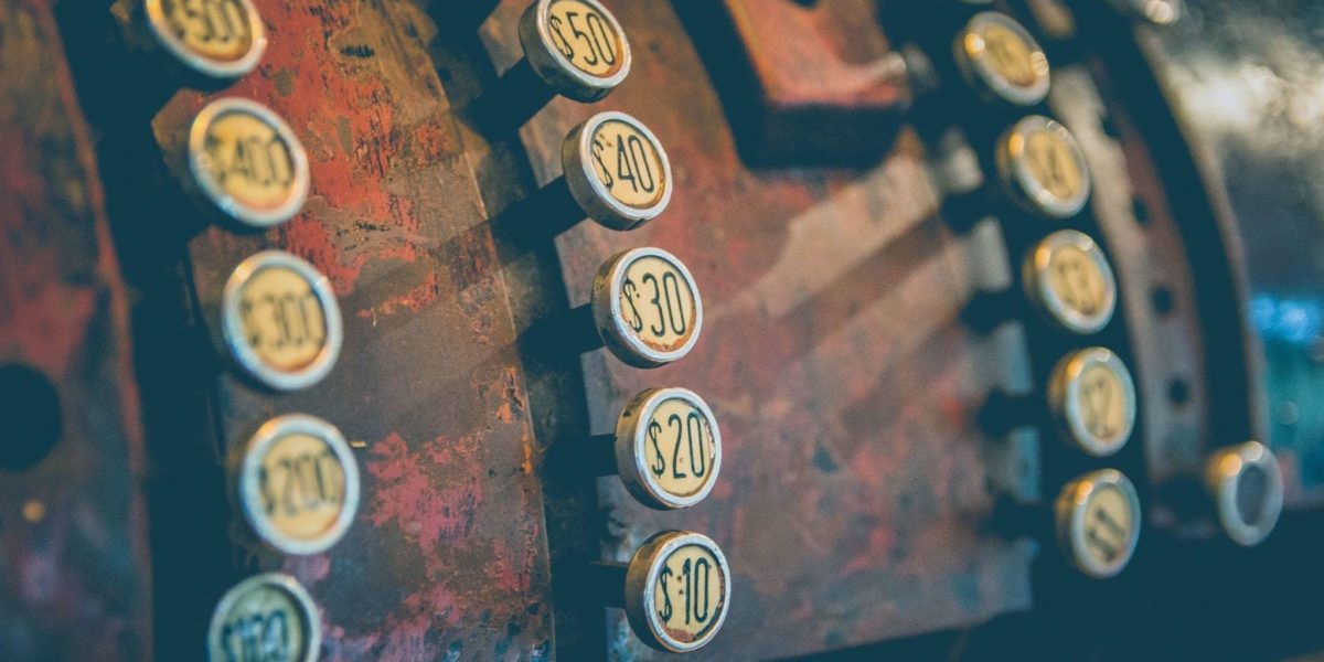 a closeup photo of vintage cash register buttons
