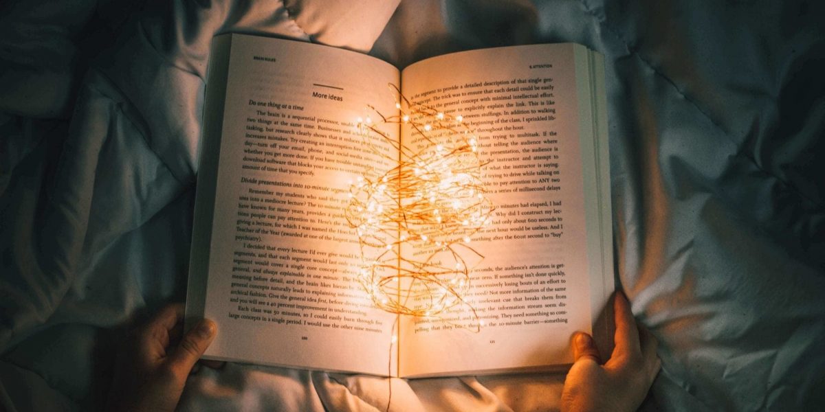 an open book willed with small lights